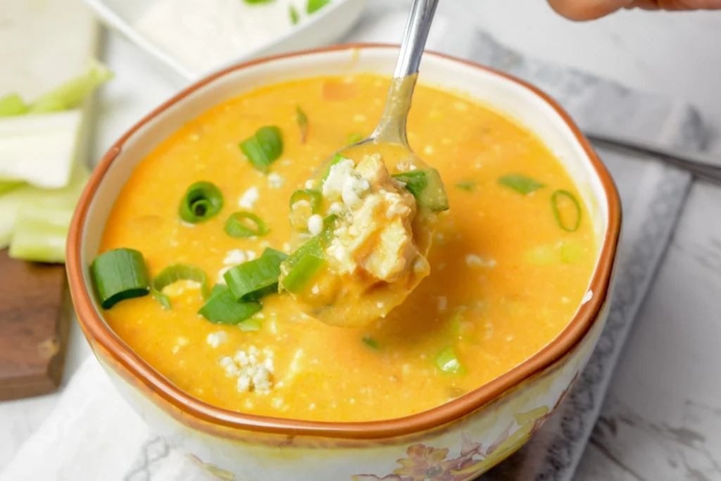 Buffalo chicken soup on a spoon