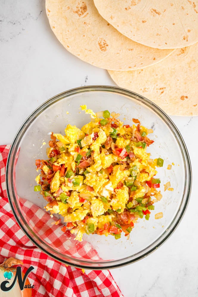 add-bacon-and-veggies-to-the-scrambled-eggs.