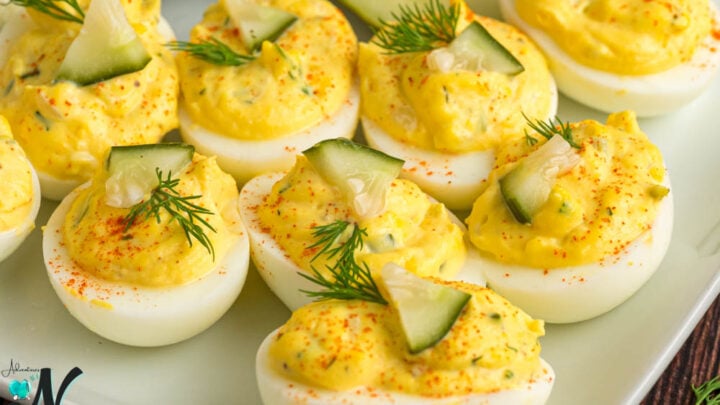 deviled-eggs-with-pickles-on-a-tray