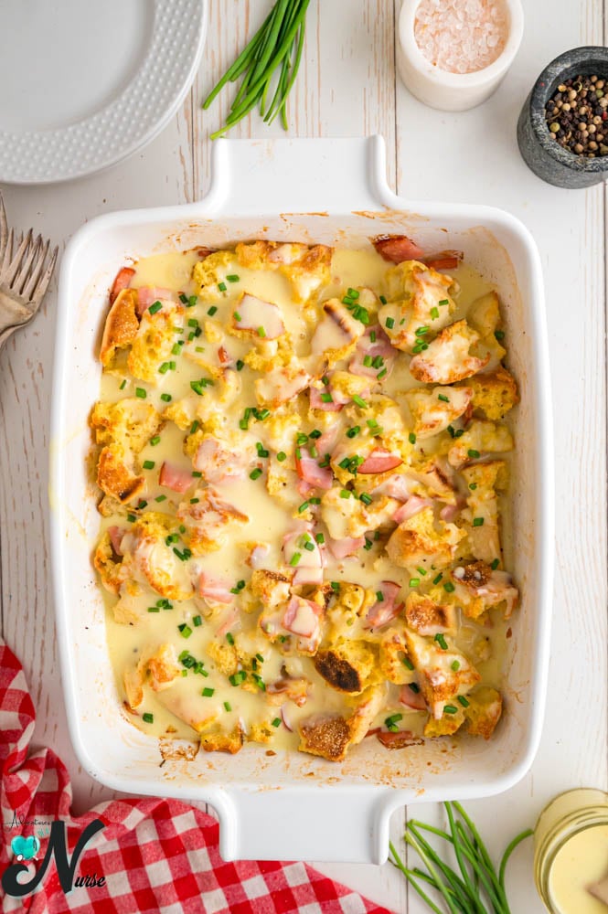 add-chopped-chives-to-top-of-eggs-benedict-casserole.