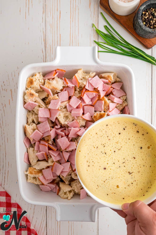 add-meat-on-top-of-muffins-and-pour-eggs.