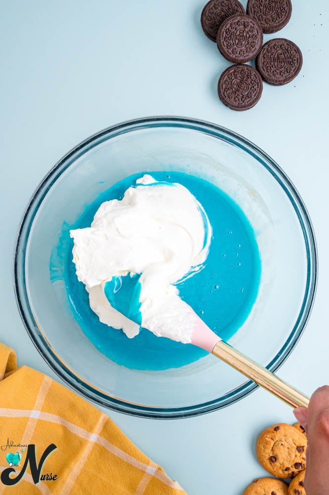 Gently-fold-the-whipped-cream-into-the-blue-condensed-milk-mixture