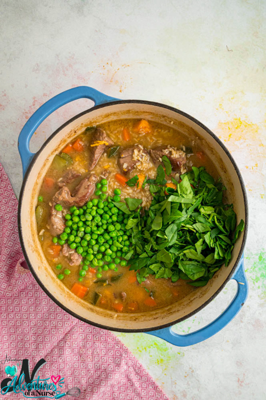 Frozen green peas and chopped fresh spinach added to the lamb and rice mixture.