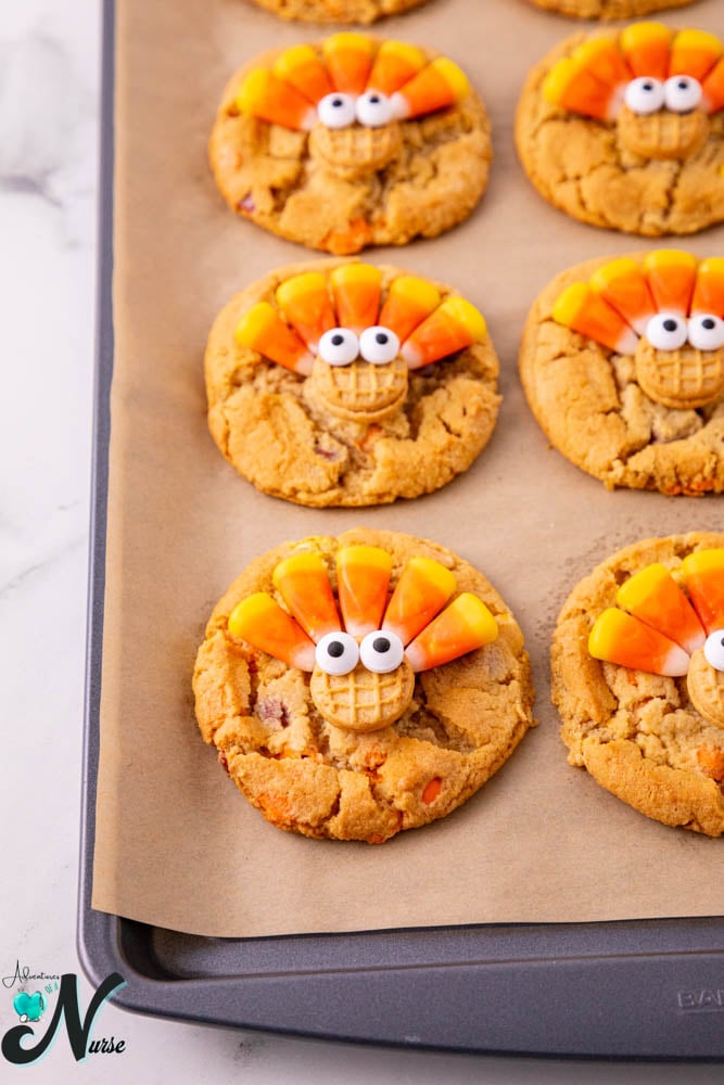attach candy corn feathers