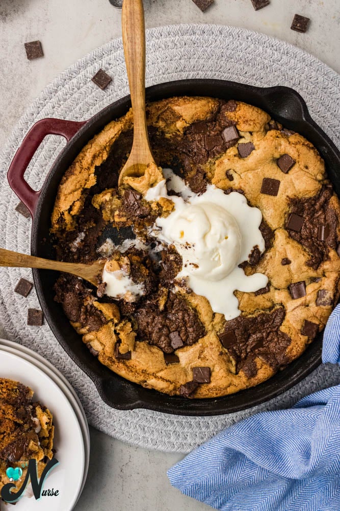 brookie with ice cream and spoons in pan